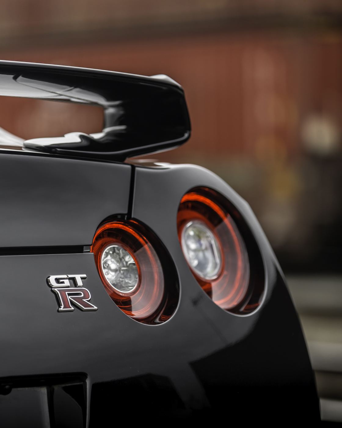 Close-up of Nissan GT-R round taillights and badge
